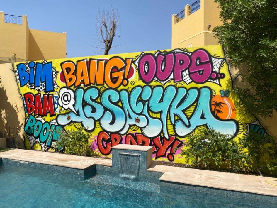 Colourful spray paint artwork on canvas – modern street art style